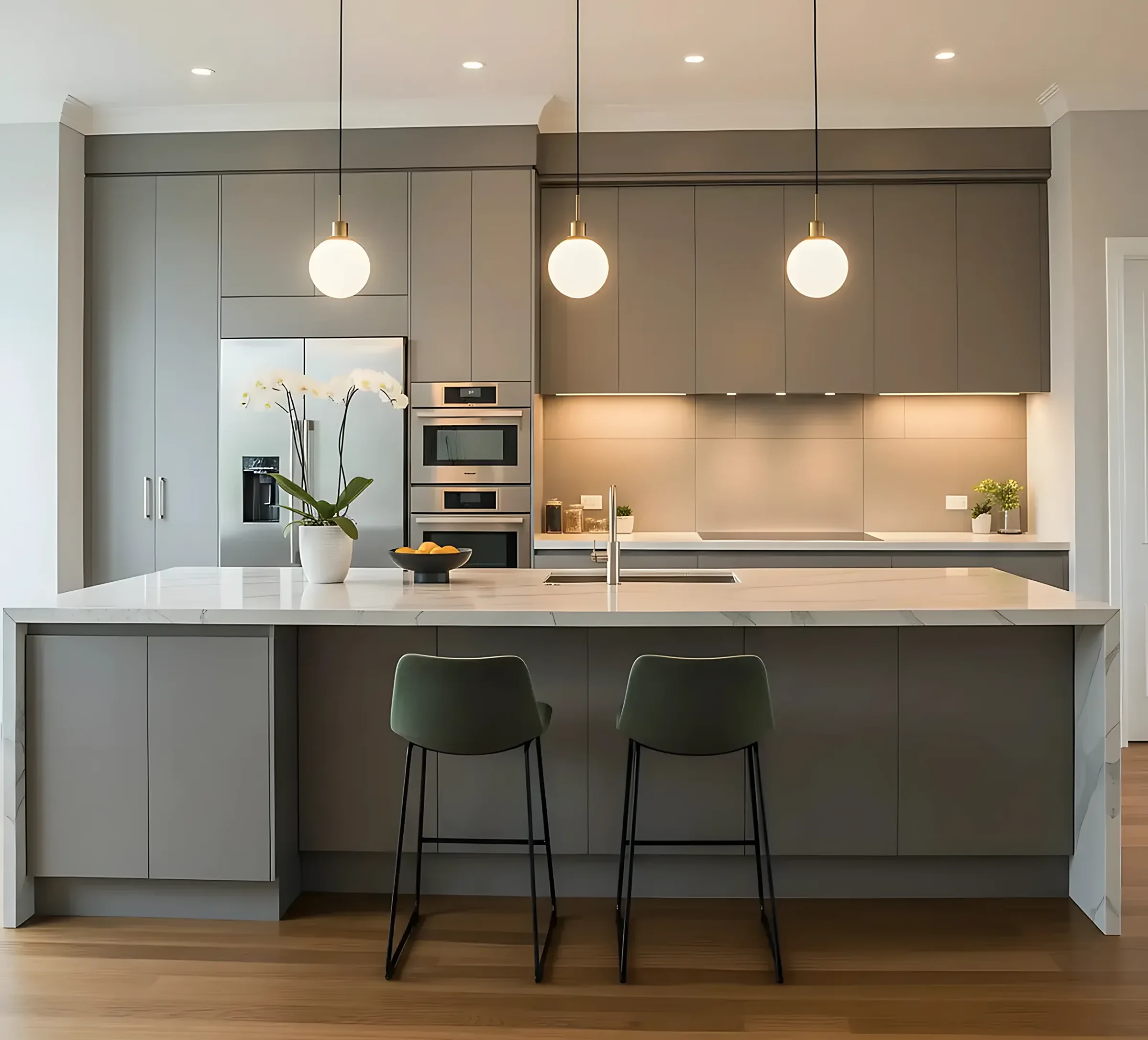 Charcoal-cabinet kitchen remodel with warm lighting